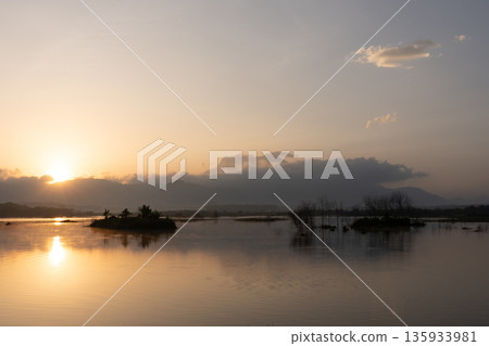 A nature view of sunset or sunrise over lake at Phang Nga Thailand A nature view of sunset or sunrise over lake at Phang Nga Thailand 135933981