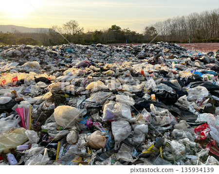 landfill filled with plastic waste and garbage, the contrast between natural beauty, human pollution, highlighting environmental crisis, overconsumption, sustainability issues, climate impact landfill filled with plastic waste and garbage, the contrast between natural beauty, human pollution, highlighting environmental crisis, overconsumption, sustainability issues, climate impact 135934139