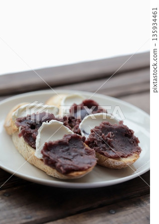 Open sandwich with bean paste and cream cheese made with whole wheat rustic bread 135934461