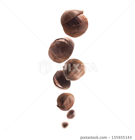 Ripe chestnuts levitate on a white background 135935143