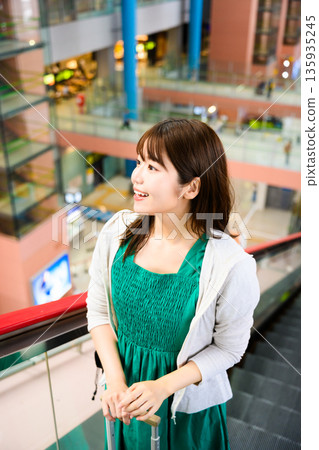 A woman waiting for her trip at the airport. Photo courtesy of Kansai International Airport (KIX). A woman waiting for her trip at the airport. Photo courtesy of Kansai International Airport (KIX). 135935245