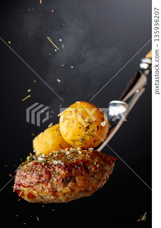Roasted potatoes with cutlet and thyme. Roasted potatoes with cutlet and thyme. 135936207
