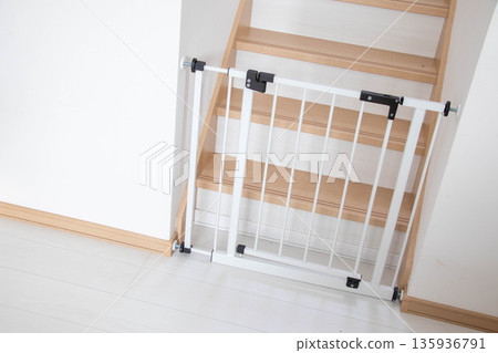 Safety measures for baby gates installed on stairs 135936791
