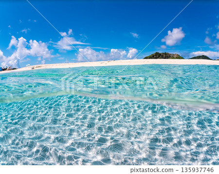 Partially submerged photograph of the white sand beaches of the Kerama Islands. Kahi Island and Amuro Island, beautiful coral reefs and schools of tropical fish. Kahi Island, Shimajiri District, Okinawa Prefecture 135937746