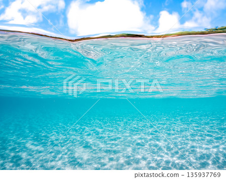 Partially submerged photograph of the white sand beaches of the Kerama Islands. Kahi Island and Amuro Island, beautiful coral reefs and schools of tropical fish. Kahi Island, Shimajiri District, Okinawa Prefecture Partially submerged photograph of the white sand beaches of the Kerama Islands. Kahi Island and Amuro Island, beautiful coral reefs and schools of tropical fish. Kahi Island, Shimajiri District, Okinawa Prefecture 135937769