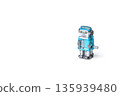Blue tin robot retro toy on white background, copy space on the left 135939480