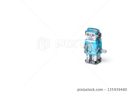 Blue tin robot retro toy on white background, copy space on the left Blue tin robot retro toy on white background, copy space on the left 135939480