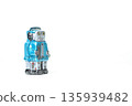 Blue tin robot retro toy on white background, copy space on the right 135939482