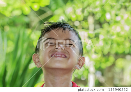 Closeup portrait of Asian cute little kid boy smiling Closeup portrait of Asian cute little kid boy smiling 135940232