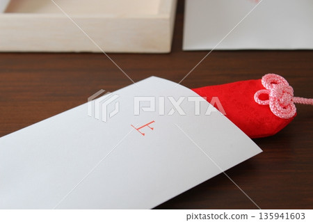 Buying amulets in a paper bag [Close-up, simple, copy space] 135941603