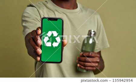 A businessman holding a modern smartphone with a green screen display for digital communication and wireless technology A businessman holding a modern smartphone with a green screen display for digital communication and wireless technology 135942954