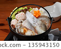 A single serving of luxurious seafood in an iron pot 135943150