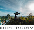 Pagoda pavilion atop Marble Mountains aerial view blue sky, Temple lookout on karst peak overlooking Danang valley panorama 135943578