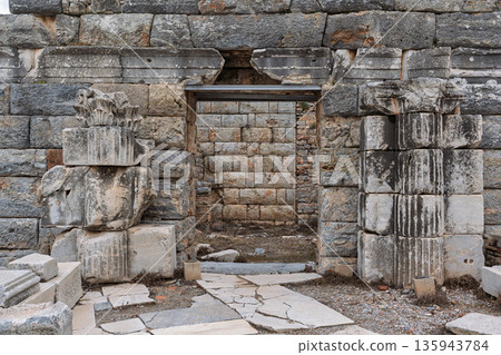 Ancient stone wall and passage ruins at the Ancient City of Ephesus, Selcuk, Turkey Ancient stone wall and passage ruins at the Ancient City of Ephesus, Selcuk, Turkey 135943784