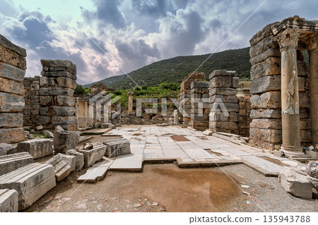Dramatic cloudy sky over the ancient ruins of Ephesus, historic columns and stone blocks, Selcuk, Izmir Province, Turkey Dramatic cloudy sky over the ancient ruins of Ephesus, historic columns and stone blocks, Selcuk, Izmir Province, Turkey 135943788