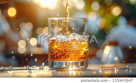 A cold glass of beer and a bubbly glass of champagne sit on a bar table near a whiskey cocktail with ice cubes, creating a refreshing alcoholic beverage display for a party A cold glass of beer and a bubbly glass of champagne sit on a bar table near a whiskey cocktail with ice cubes, creating a refreshing alcoholic beverage display for a party 135943847