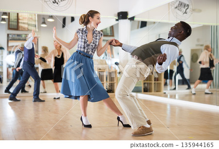Woman and man dancing swing in studio 135944165