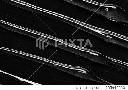 A moisturizer or body gel or a facial serum. Black background. 135946630