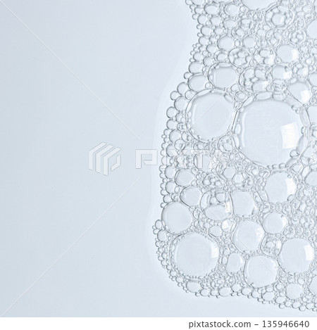 Bubbles of body gel or soap foam or shaving gel. Closeup. 135946640