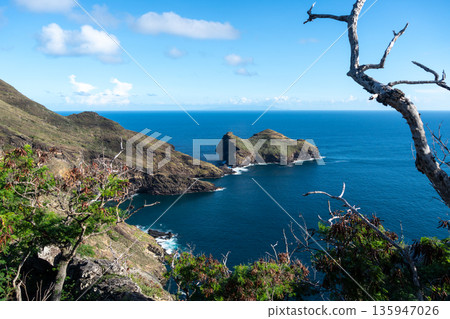 Cliffs and coastline of Taiohae Bay in Nuku Hiva, Marquesas Islands, French Polynesia Cliffs and coastline of Taiohae Bay in Nuku Hiva, Marquesas Islands, French Polynesia 135947026