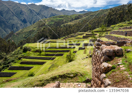Inca archaeological site of Chinchero with terraces and mountain backdrop Inca archaeological site of Chinchero with terraces and mountain backdrop 135947036