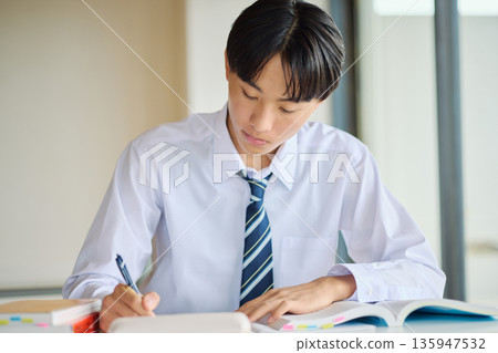 High school boy studying hard 135947532