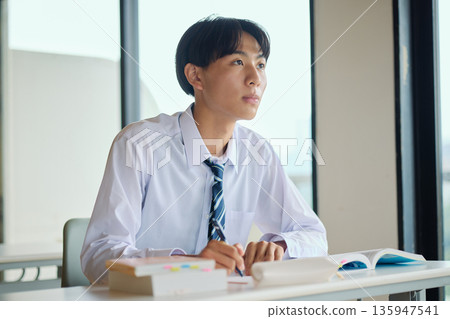 High school boy studying hard 135947541