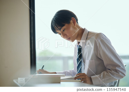 High school boy studying hard 135947548
