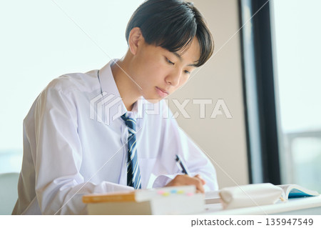 High school boy studying hard 135947549
