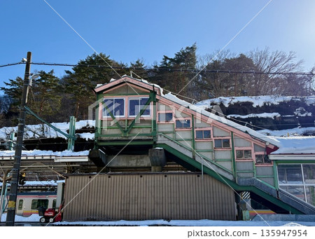 Snow-covered Minakami Station overpass and blue sky Snow-covered Minakami Station overpass and blue sky 135947954