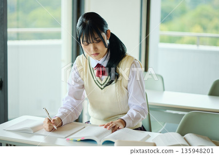 High school girls studying hard for exams 135948201