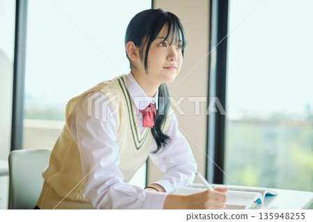 High school girls studying hard for exams High school girls studying hard for exams 135948255