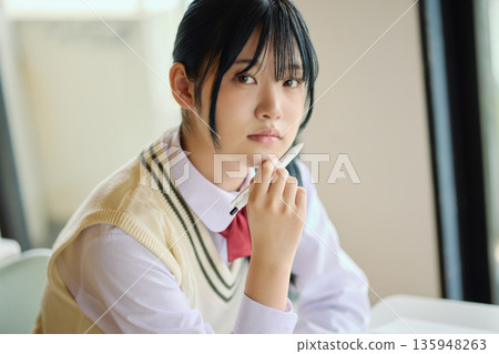 High school girls studying hard for exams High school girls studying hard for exams 135948263