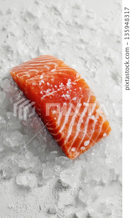 Fresh salmon fillet resting on crushed ice for culinary delight and preparation Fresh salmon fillet resting on crushed ice for culinary delight and preparation 135948317