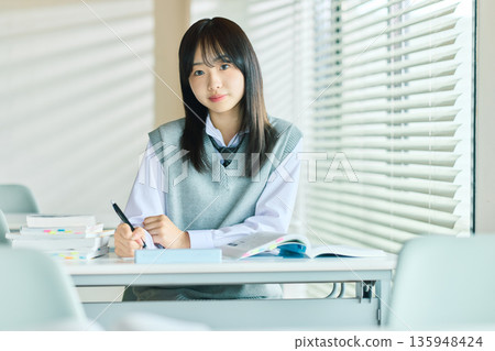 Female students taking classes 135948424