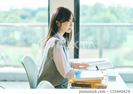 Female students taking classes 135948429