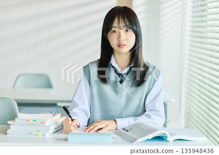 Female students taking classes 135948436