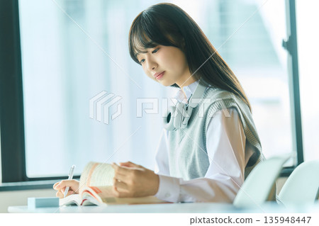 Female students taking classes Female students taking classes 135948447