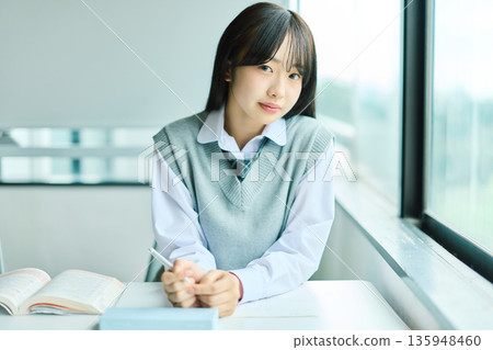 Female students taking classes 135948460