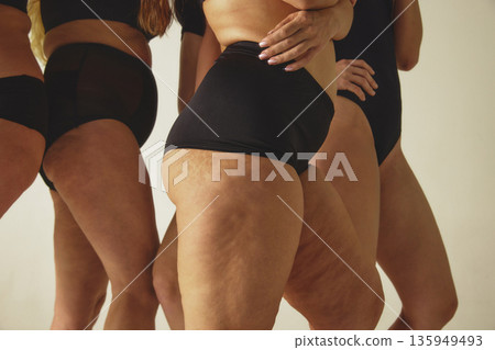 Women bodies close up in black underwear on studio background. Women bodies close up in black underwear on studio background. 135949493