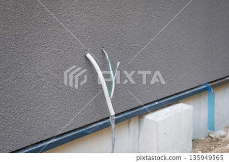 Electrical wiring coming out of the wall 135949565