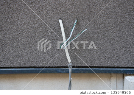Electrical wiring coming out of the wall 135949566
