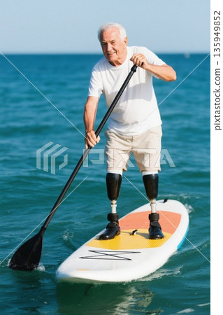 Footage of disabled elderly people paddling at sea Footage of disabled elderly people paddling at sea 135949852