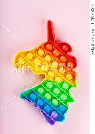 Rainbow Gradient Unicorn Pop It Fidget Sensory Toy on Soft Pink Background Stress Relief Rainbow Gradient Unicorn Pop It Fidget Sensory Toy on Soft Pink Background Stress Relief 135950866