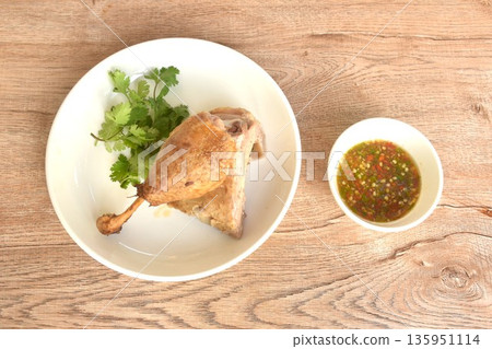 boiled duck meat and leg in black soybean sauce on plate dipping spicy chili sauce boiled duck meat and leg in black soybean sauce on plate dipping spicy chili sauce 135951114