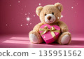 Teddy bear holding heart gift box on pink background for valentines day greeting card 135951562