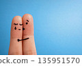 Hugging fingers with drawn faces on blue background symbolizing empathy support love care and help 135951570