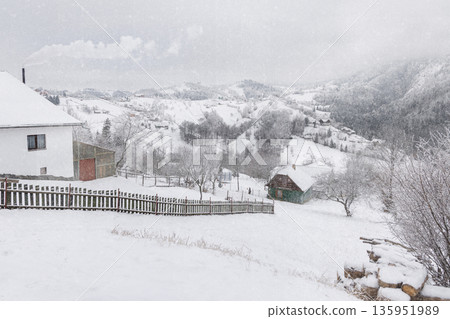 Snowy mountain village in winter, Carpathian Mountains, Romania 135951989