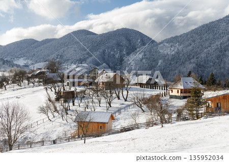 Snowy mountain village in winter, Carpathian Mountains, Romania Snowy mountain village in winter, Carpathian Mountains, Romania 135952034