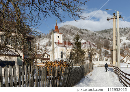 Beautiful winter landscape. Winter landscape in Magura village with Bucegi mountains, Romania Beautiful winter landscape. Winter landscape in Magura village with Bucegi mountains, Romania 135952035